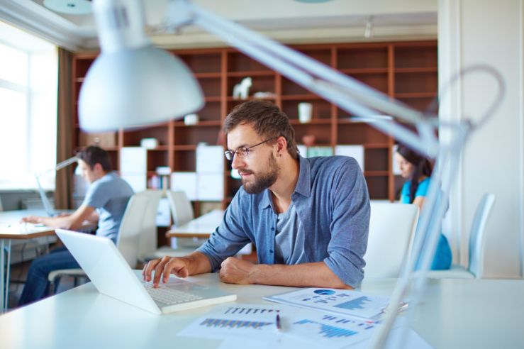 Man working at his desk on laptop in office